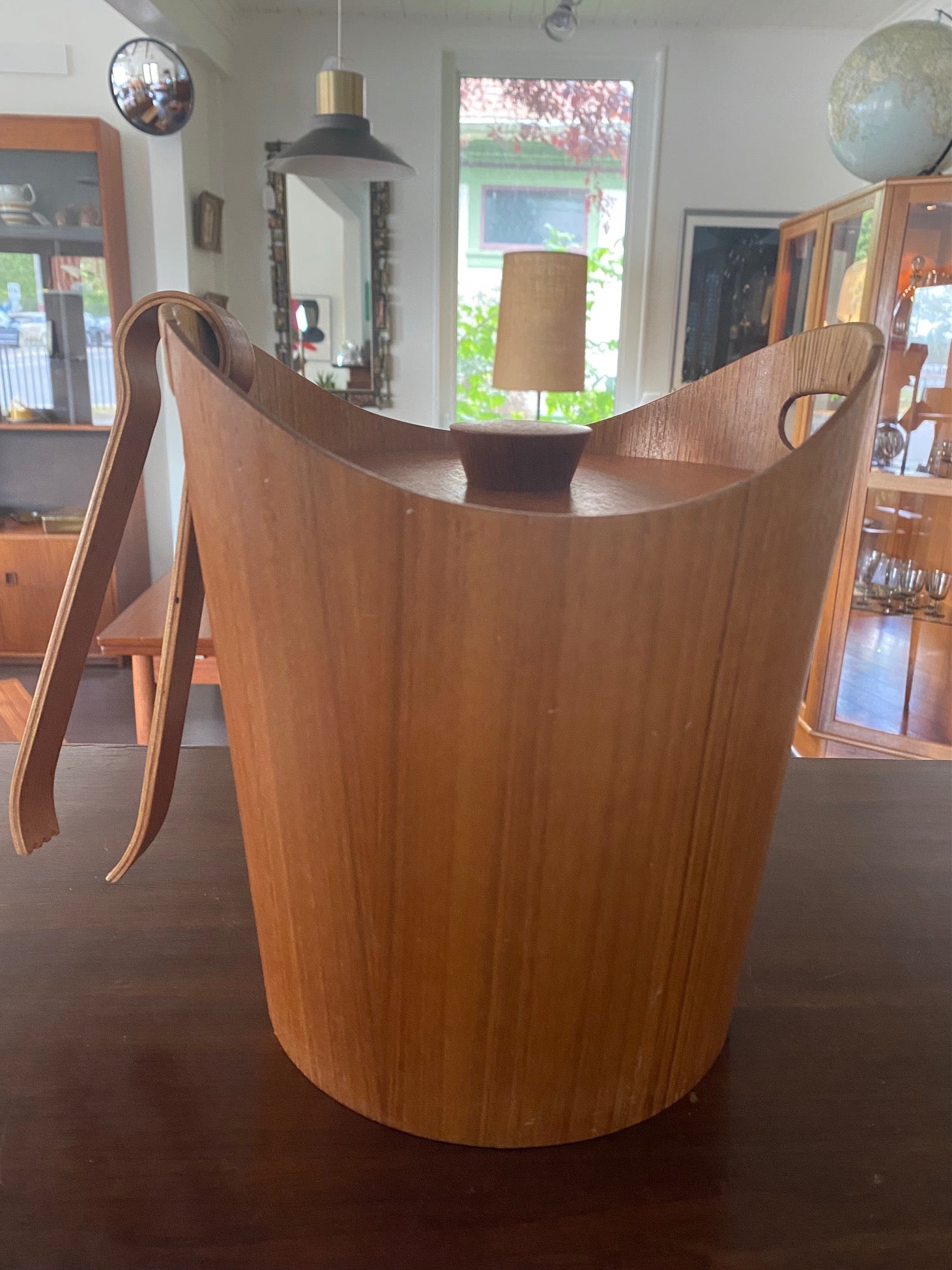 Mid-century teak ice bucket with cane handles. Original aluminum insert in great condition. Comes with matching molded teak tongs- Cook Street Vintage