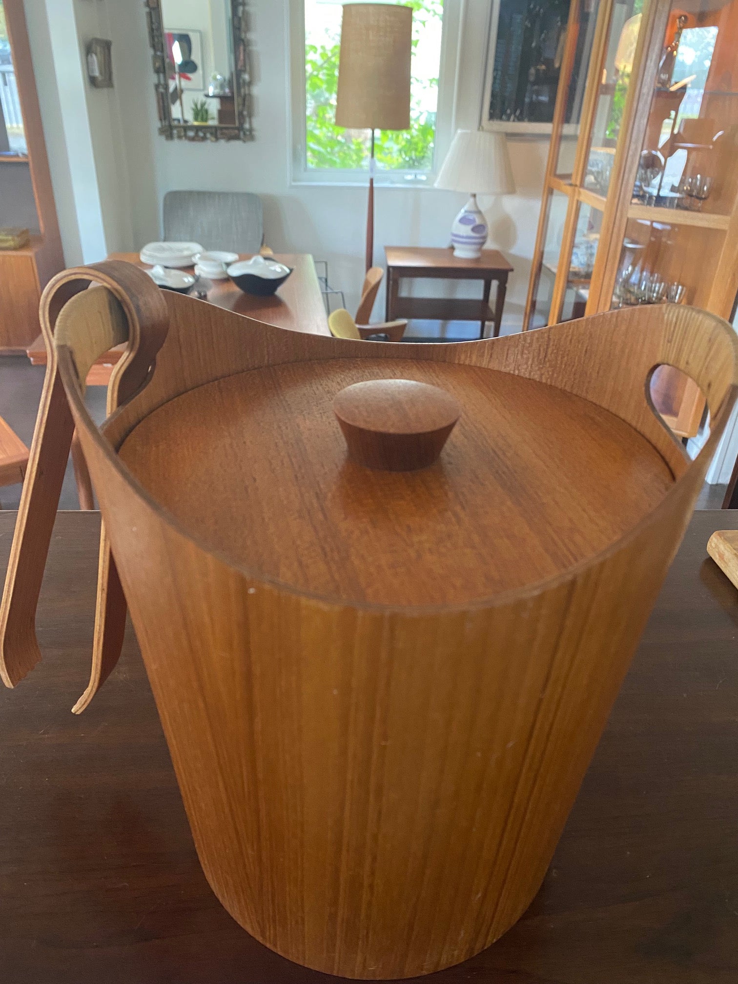 Mid-century teak ice bucket with cane handles. Original aluminum insert in great condition. Comes with matching molded teak tongs- Cook Street Vintage